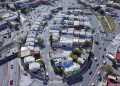 Aerial View of a Dense Urban Neighborhood with Curved Roads and White Buildings. - Adelante Mty