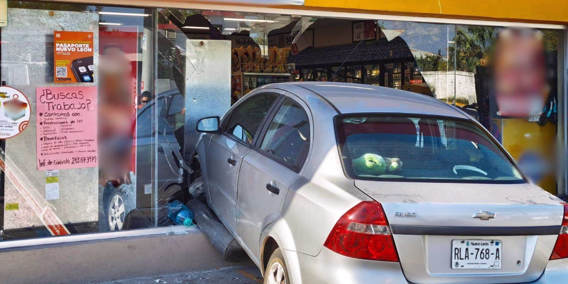 Silver Sedan Crashes into a Storefront, Breaking the Glass and Tearing Posters in the Window; Car License Plate Reads Rla-768-a. - Adelante Mty