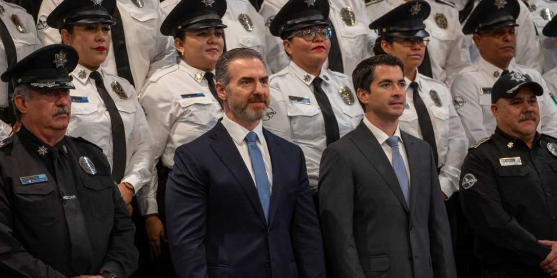 Two Men in Suits Stand in Front of a Line of Uniformed Police Officers at a Formal Event.", - Adelante Mty