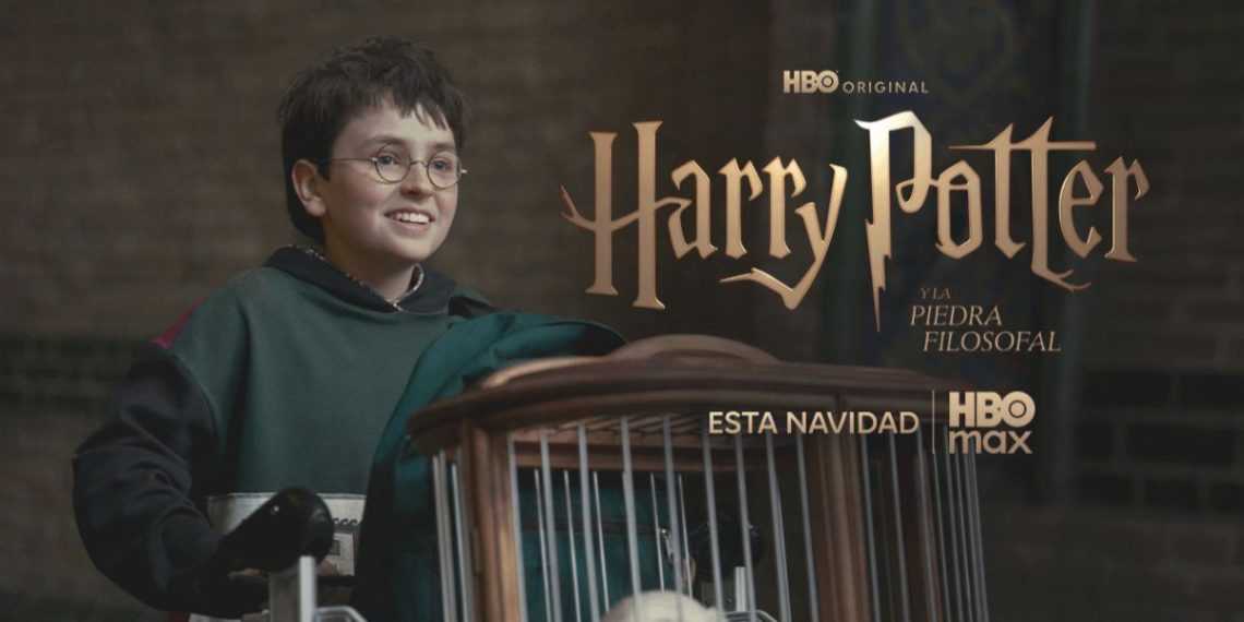 Boy with Glasses in a Green Hoodie Smiles While Pushing a Cart, in Front of a Harry Potter Promotional Backdrop with Hbo Max Branding. - Adelante Mty
