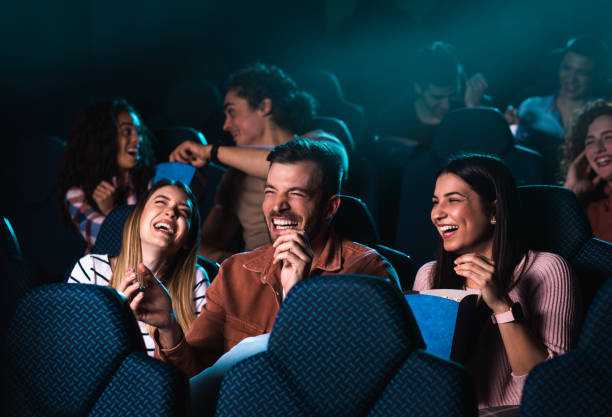 Group of Cheerful People Laughing While Watching Movie in Cinema - Adelante Mty Terror/comedia - Adelante Mty